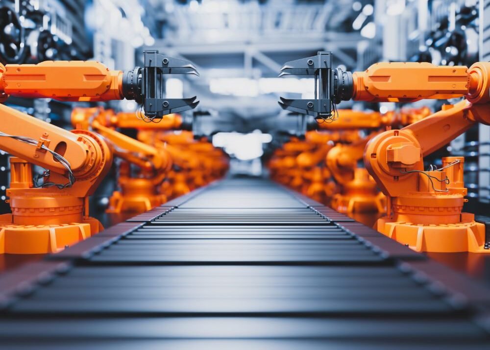 Robotic Arms Along Assembly Line In Modern Factory X4A22ZU 1 1000x715